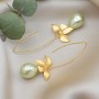 Earrings with pearls on long hooks, gilding