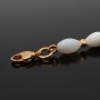 Set of chokers and mother-of-pearl earrings, gilding
