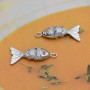 Small Fish Pendant with orange zirconia, platinum plated