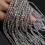 Perla natural cultivada A+ grano de arroz ~3-4mm color gris, 1 tira 36cm