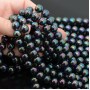 Tira de 40 cuentas de perla de concha 10mm, color pavo real negro